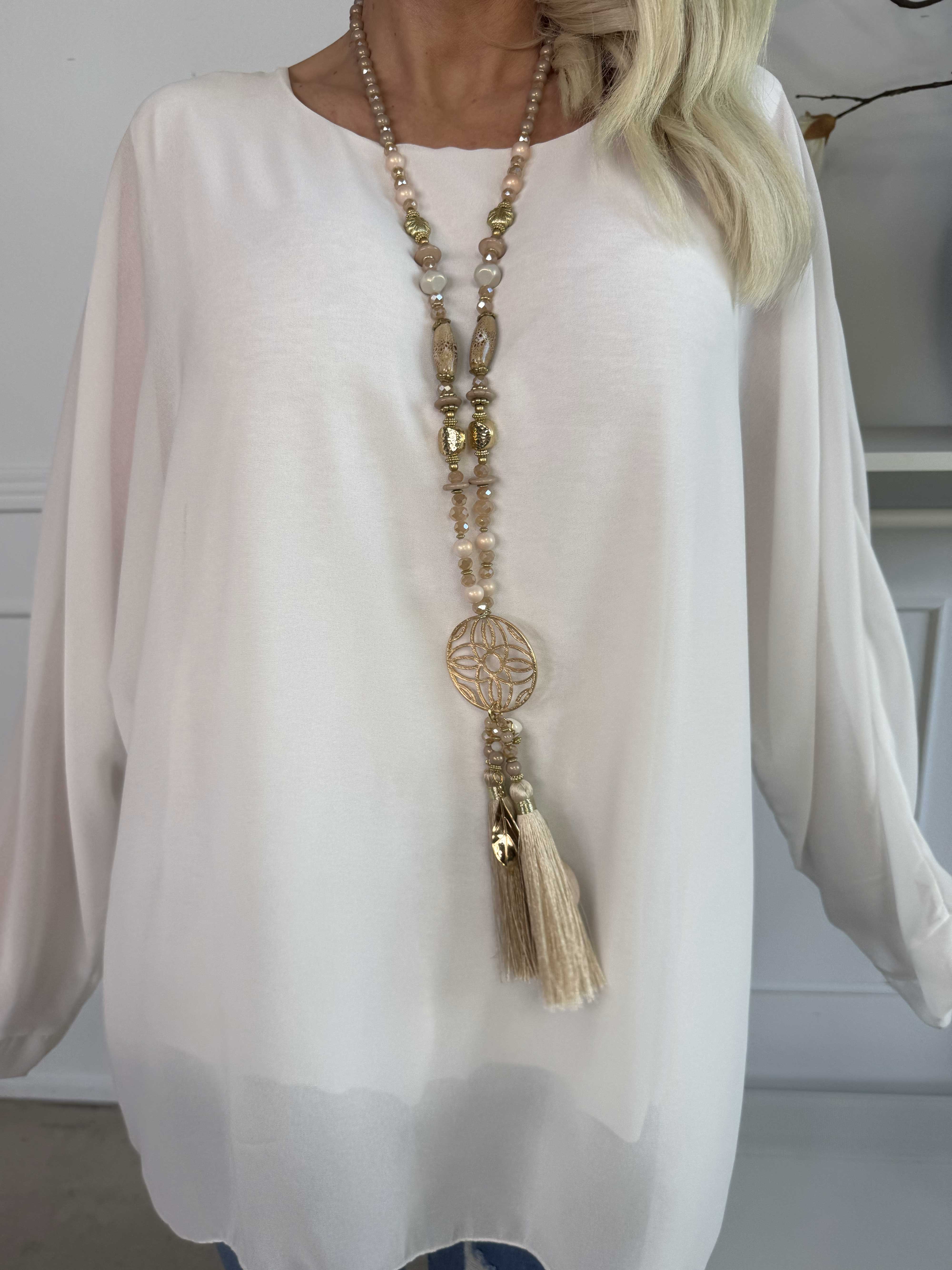 Flores - Tunika med chiffonglager och halvgenomskinliga ärmar